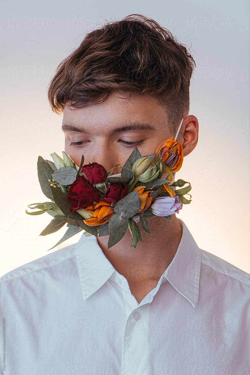 sensual man in protective flower mask