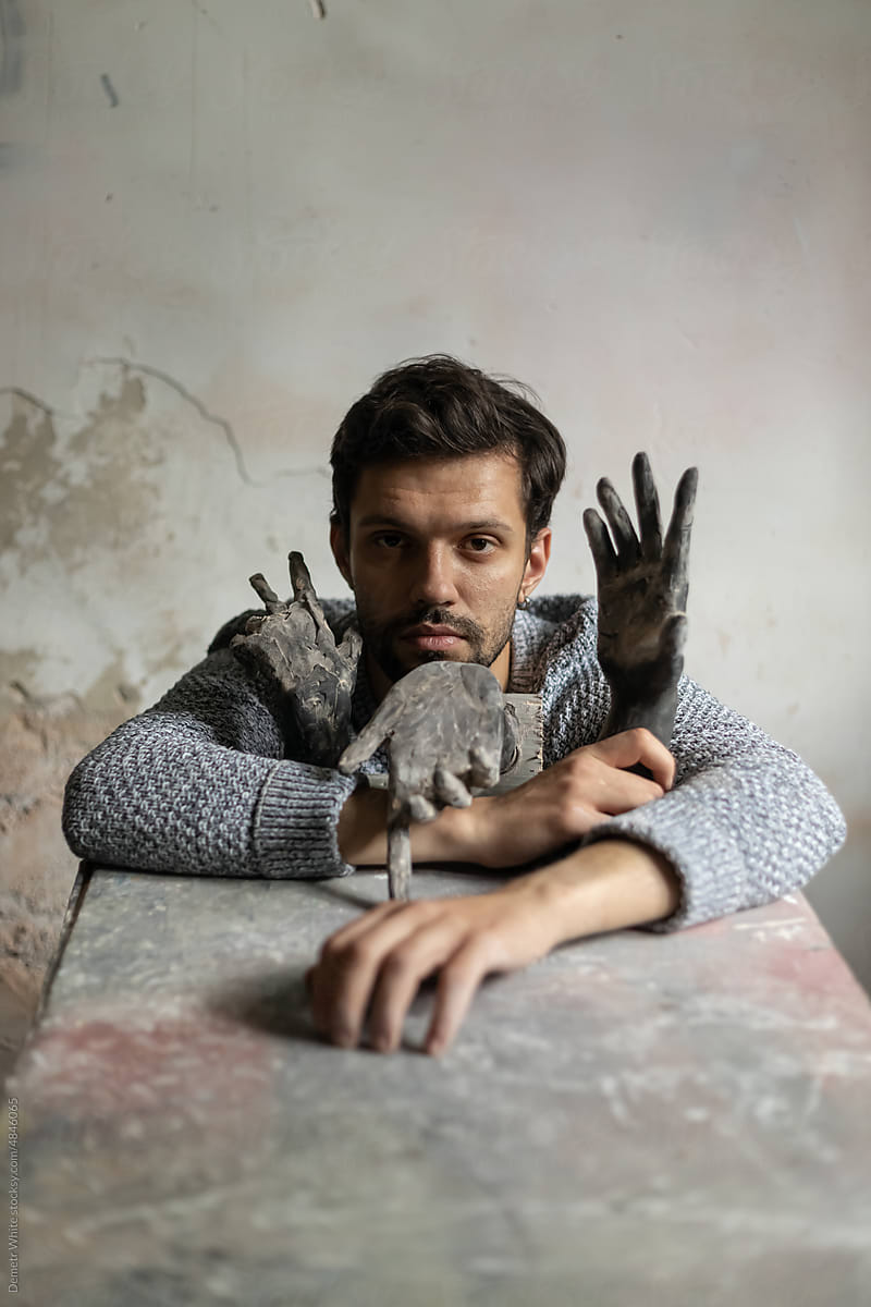 sculptor with plaster hands