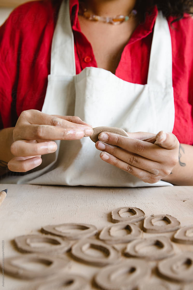 Close up of woman making ceramic earrings
