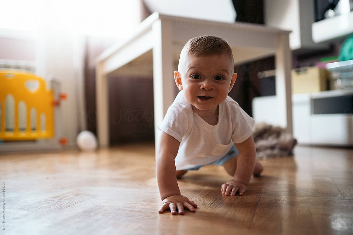 Baby Boy Crawling On The Floor