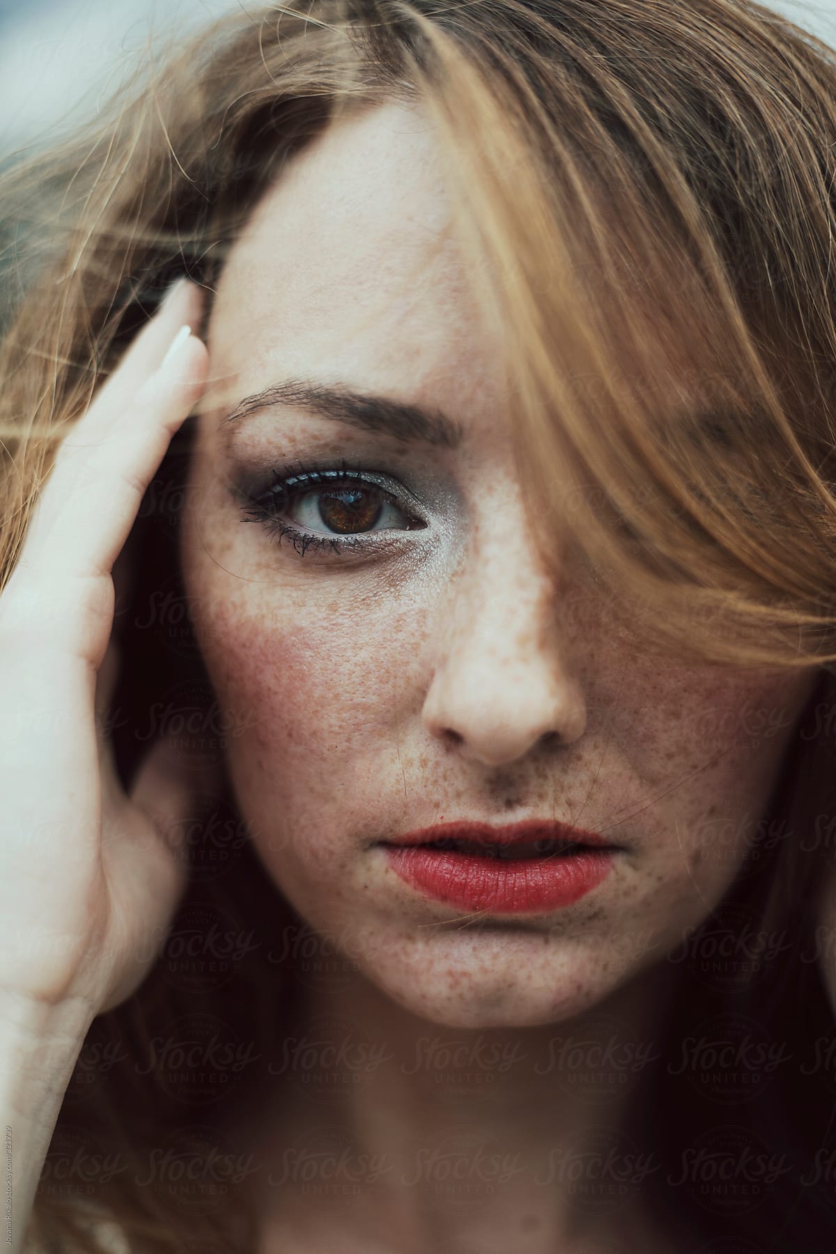 Portrait Of A Beautiful Young Woman With Freckles By Stocksy