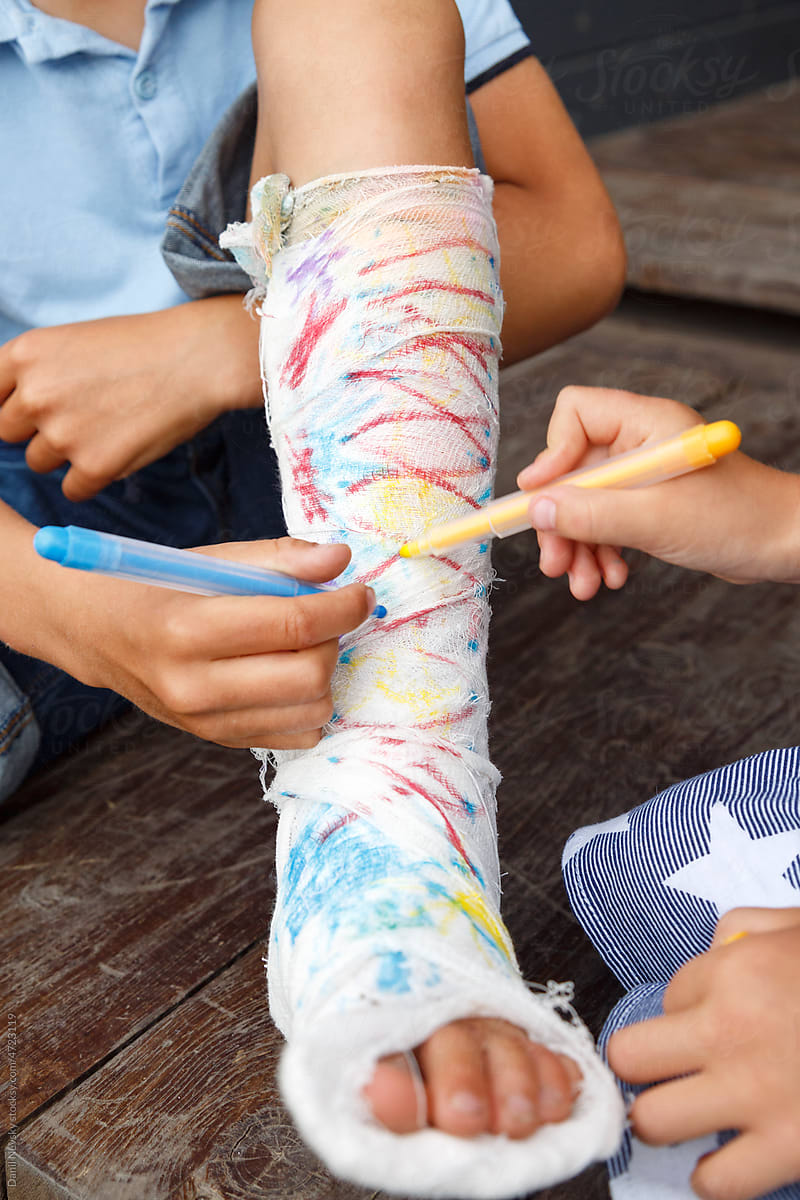 Anonymous children coloring plaster bandage