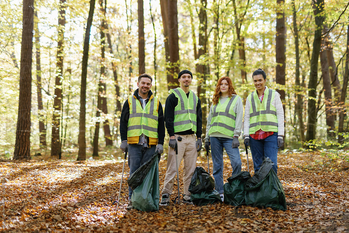 volunteers clean up bags junk nature environmental issues