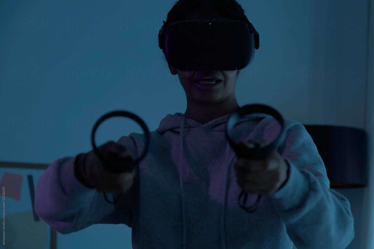 Woman playing scary game in Virtual Reality