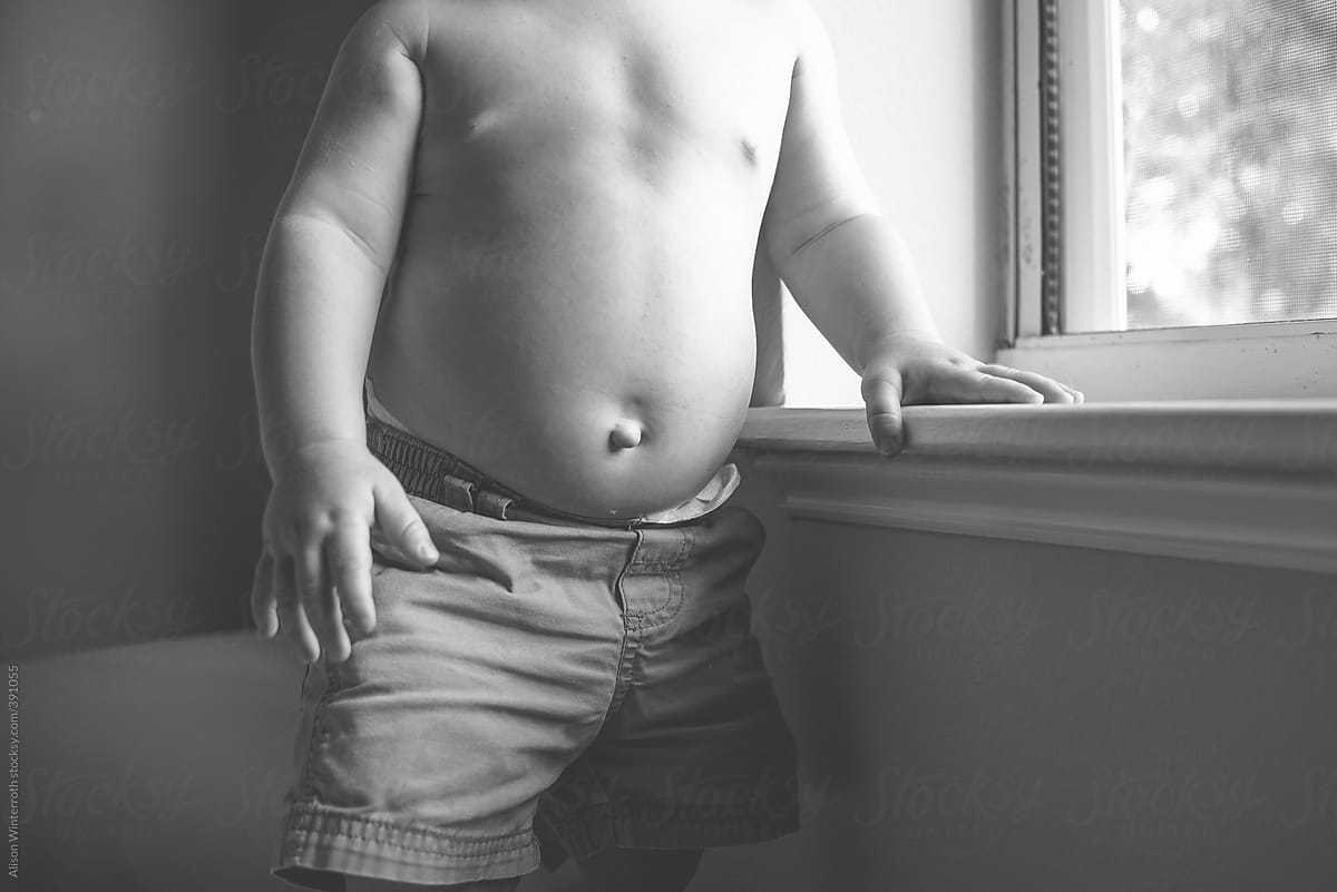 Shirtless Boy At Window Waiting Del Colaborador De Stocksy Alison Winterroth Stocksy 7351