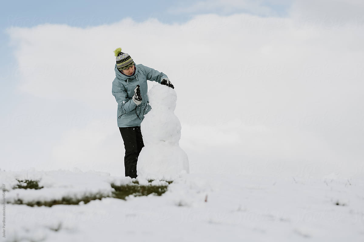 Woman make a snowman