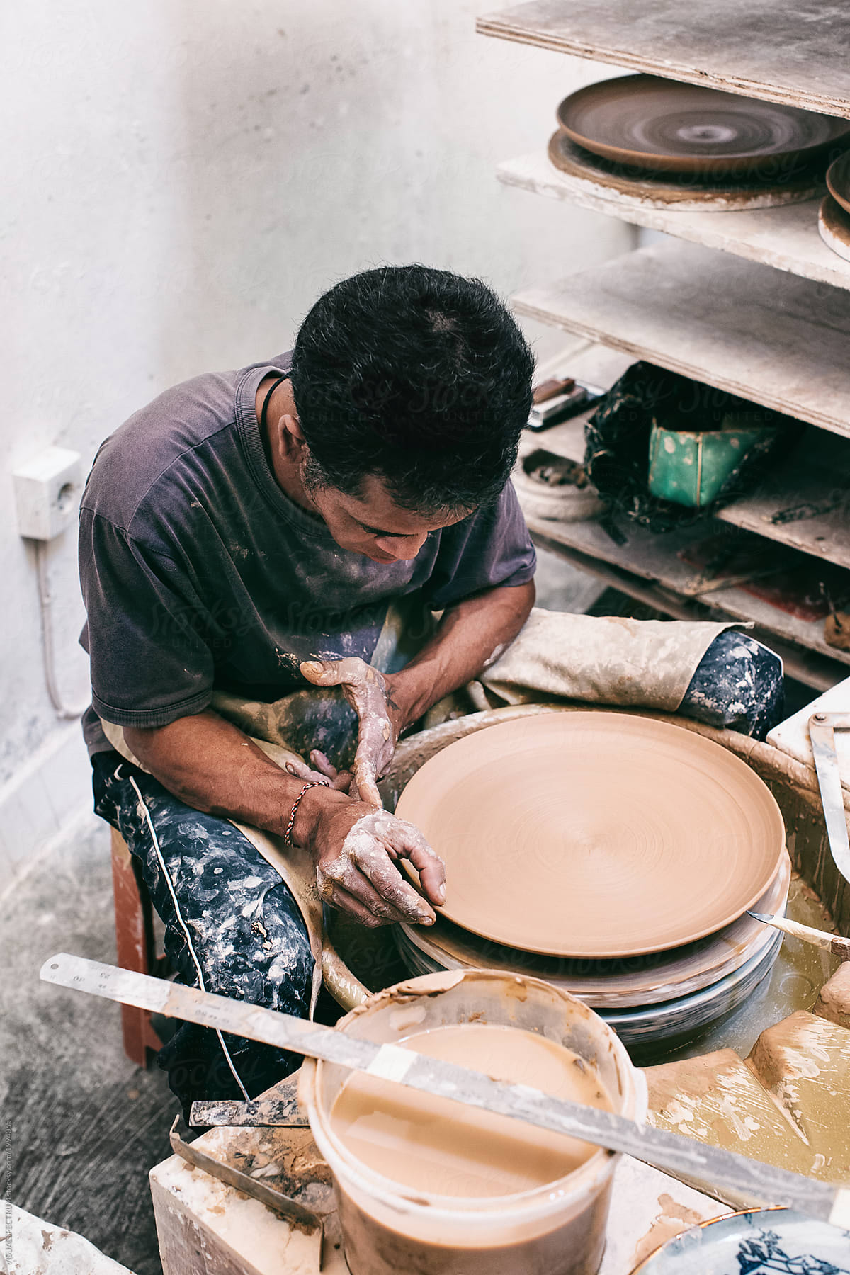 Skilful Artisan Potter Making Large Ceramic Plate