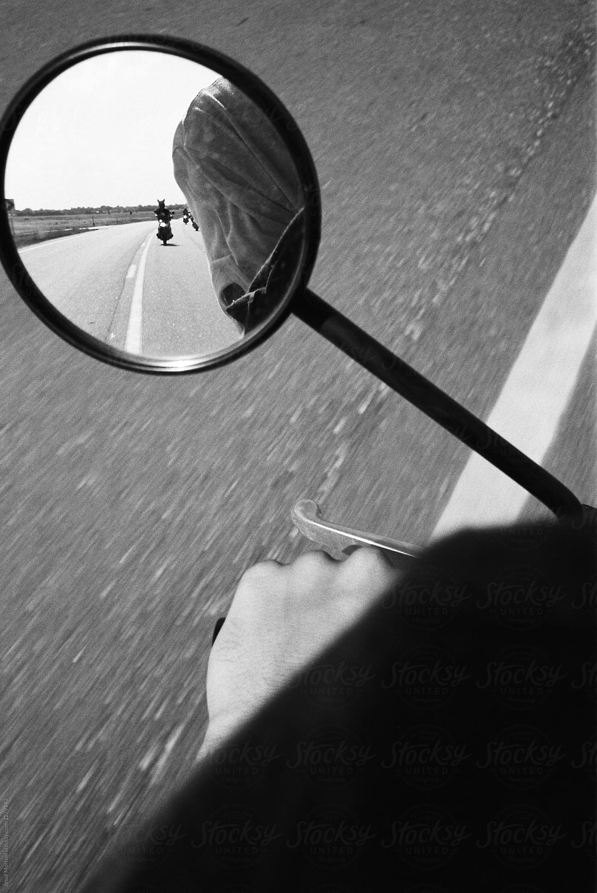 reflection in mirror while riding motorcycle