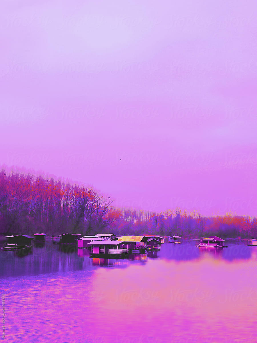 The magenta landscape of the houses on the lake.
