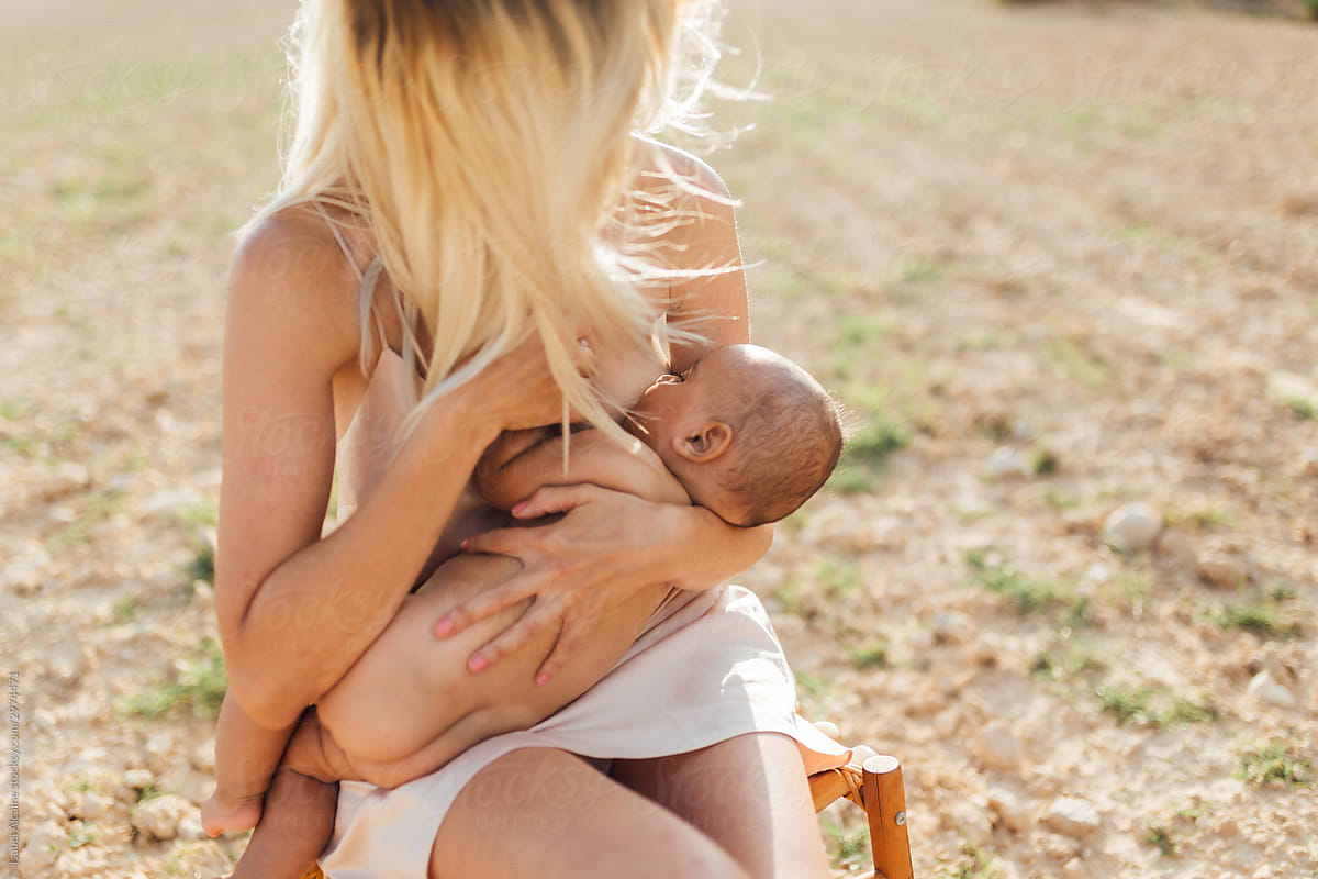 Nudist female breastfeeding