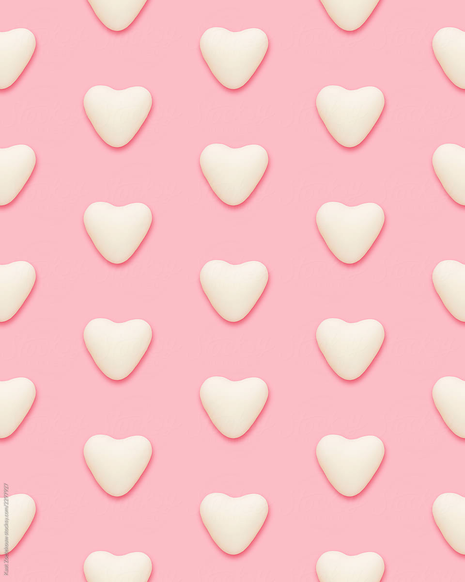 White hearts patterned on pink
