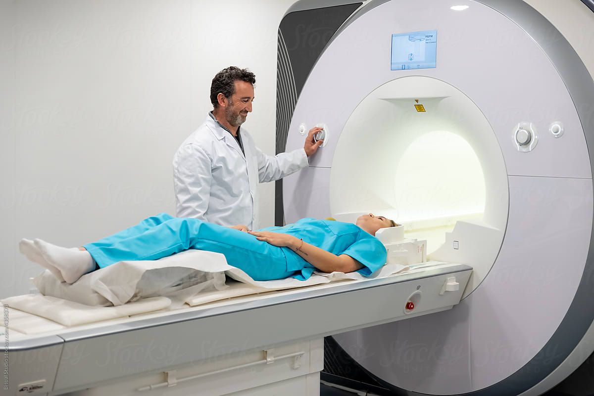 Doctor doing MRI procedure in clinic