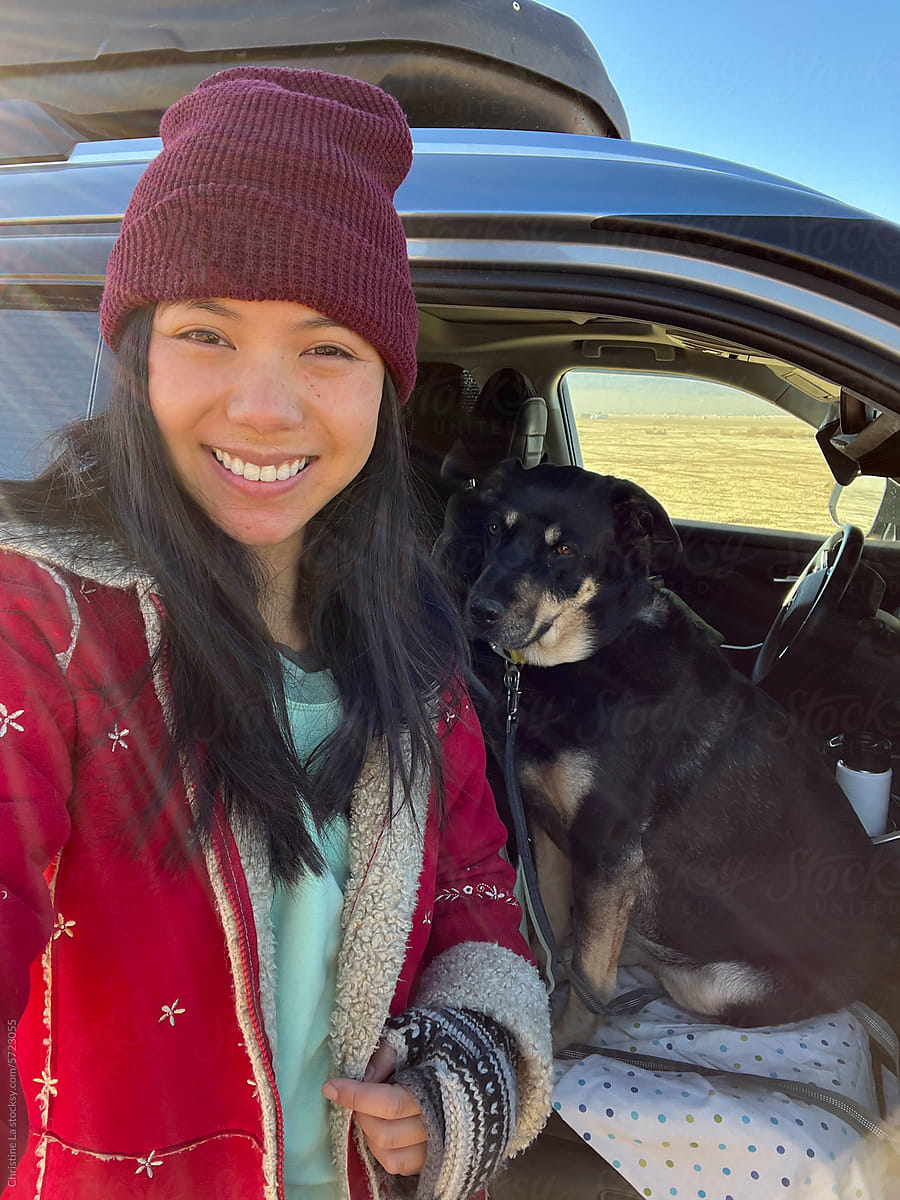 Selfie with dog next to car camper