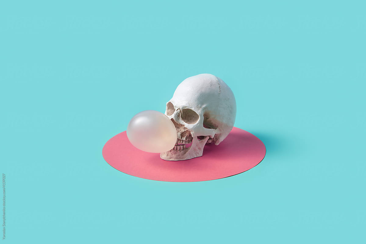 Human skull blowing bubble gum