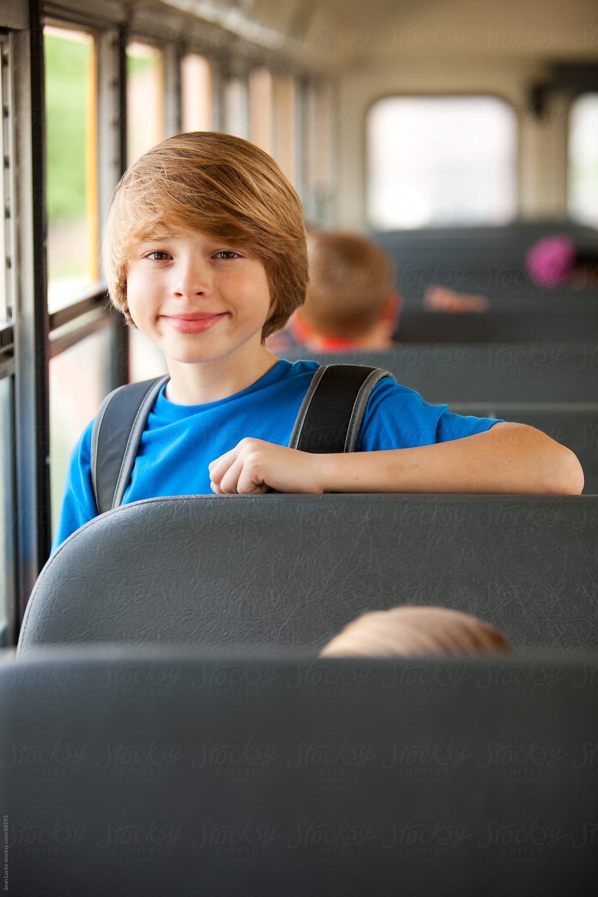 School Bus: Handsome Schoolboy on the Ride to School