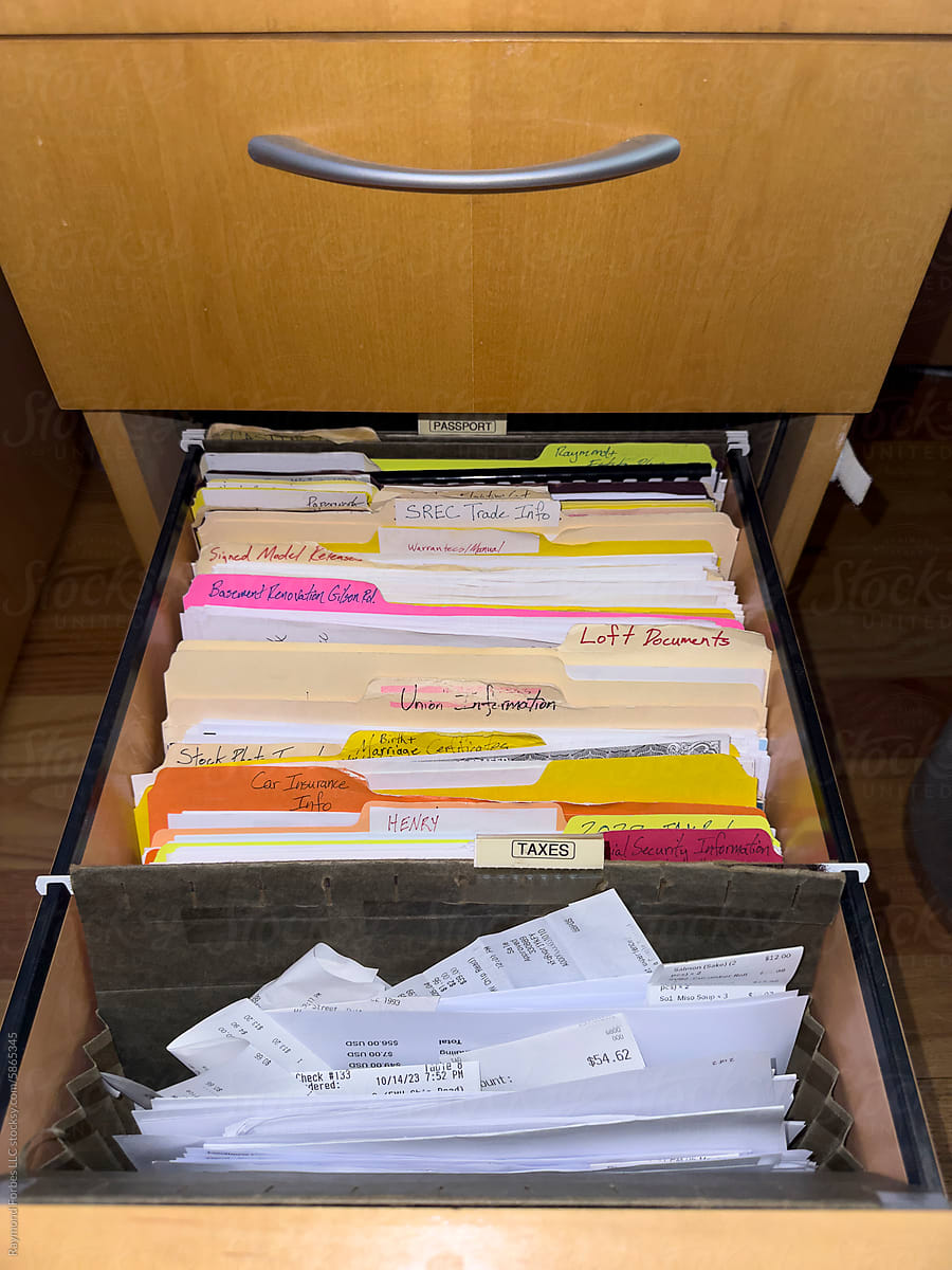 Tax Receipts in in file folder in file cabinet drawer home office