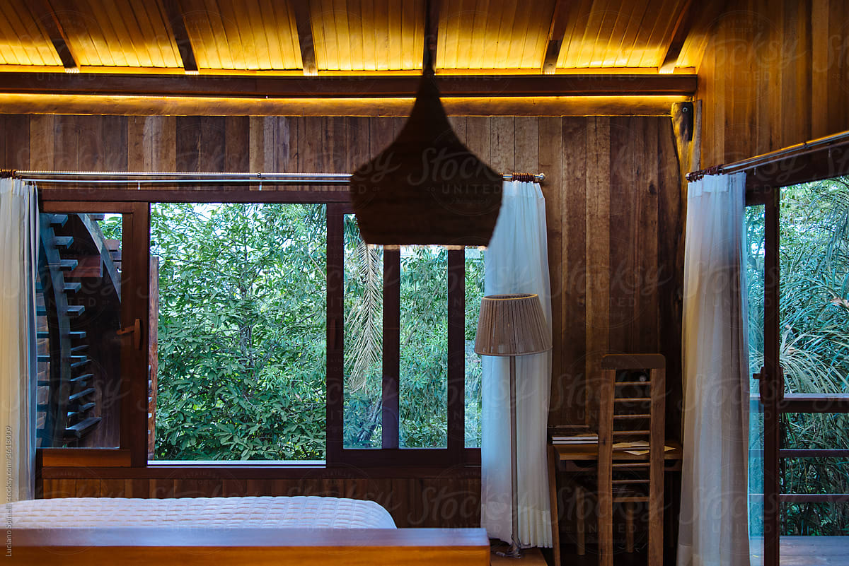 Luxury and rustic wood hotel room in the amazon forest. Jungle view.