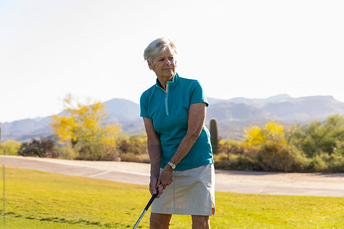 Pretty Senior Citizen Woman Playing Golf