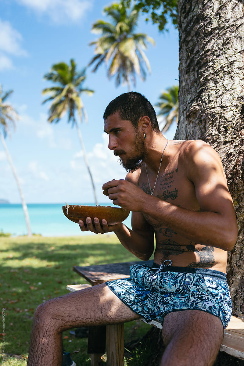 Man enjoying caribbean food at the beach