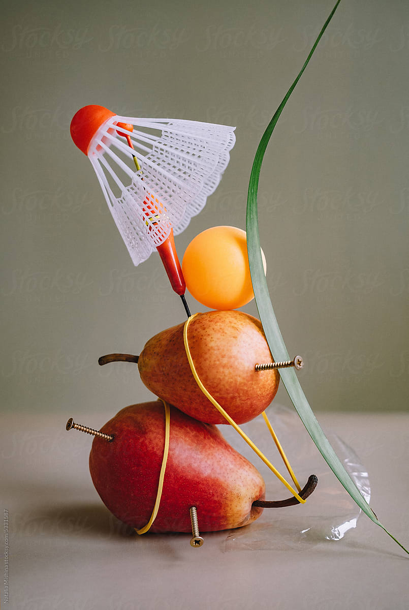 A set with pears and a ping pong ball.