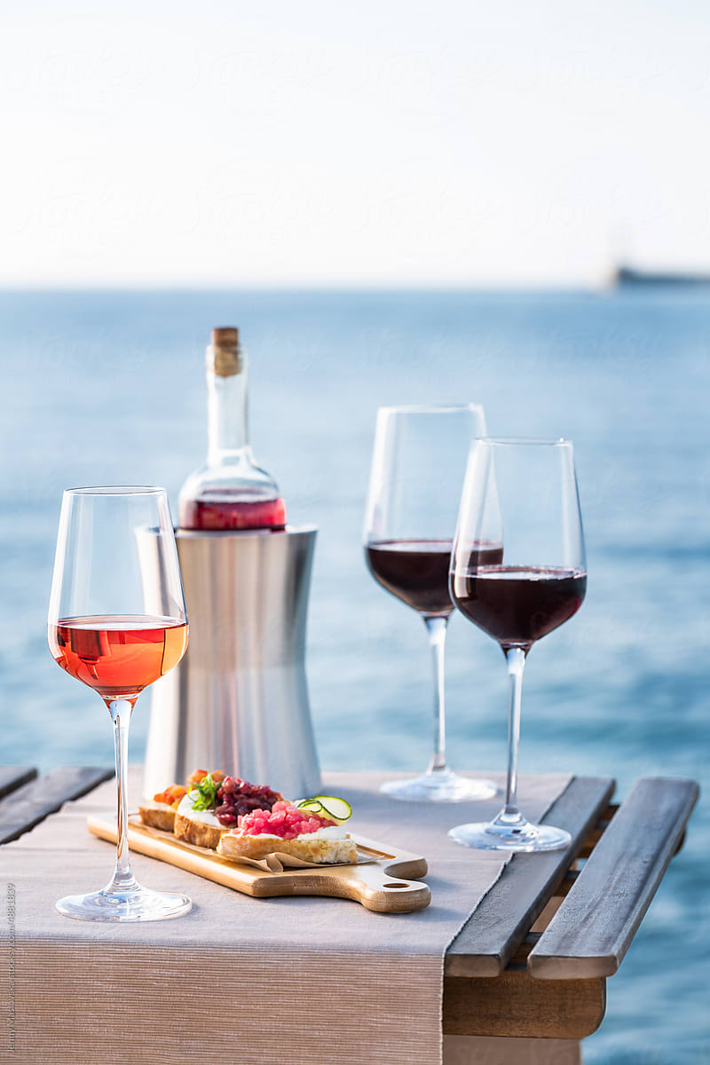 Red and Rose wine served in front of the sea