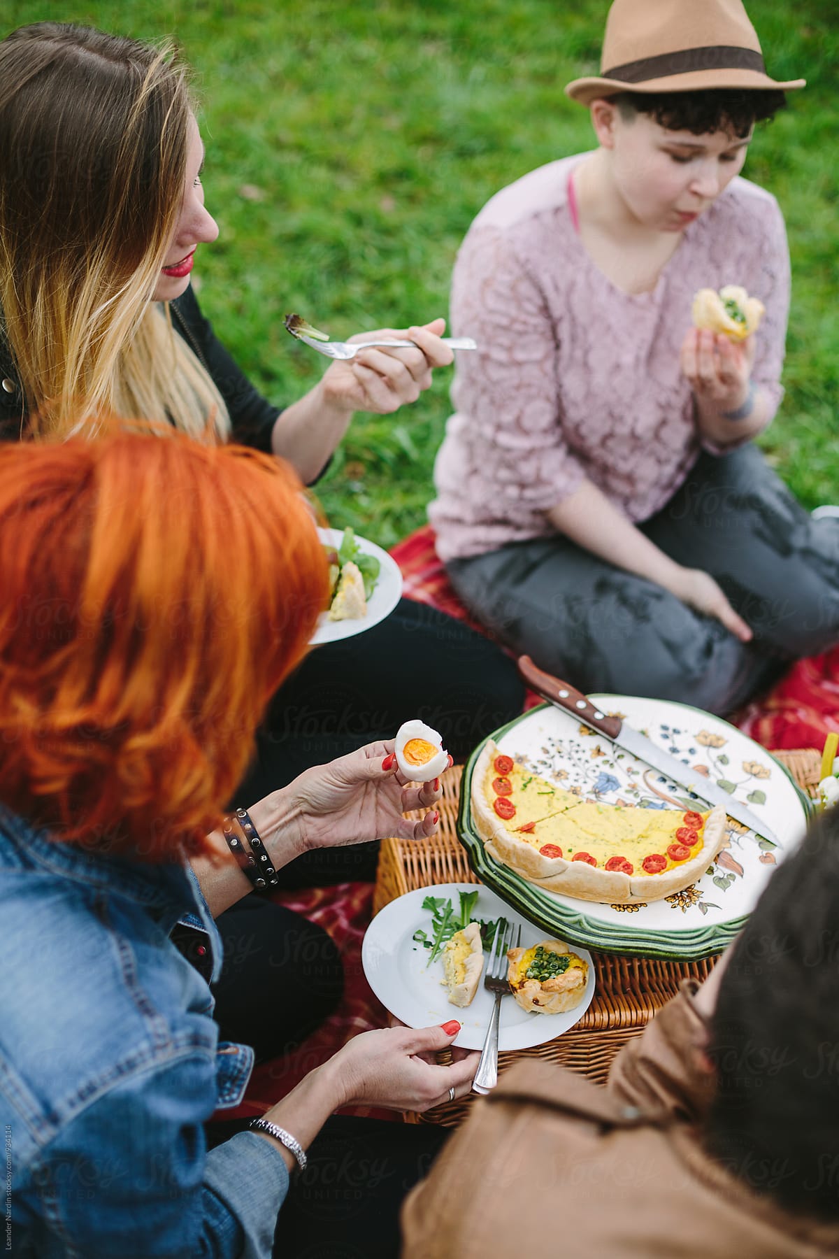 group of friends having an easter picnic outdoors