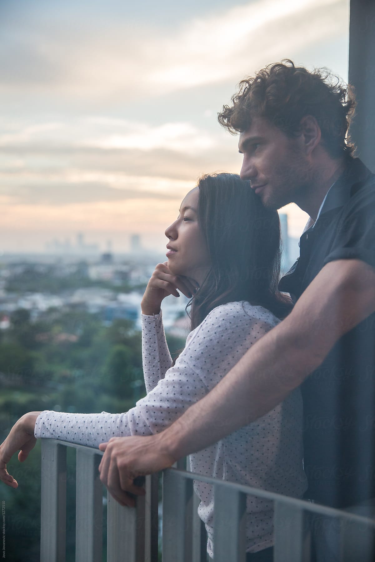 Couple In Love Watching The Sunset From Their Balcony Del Colaborador De Stocksy Jovo