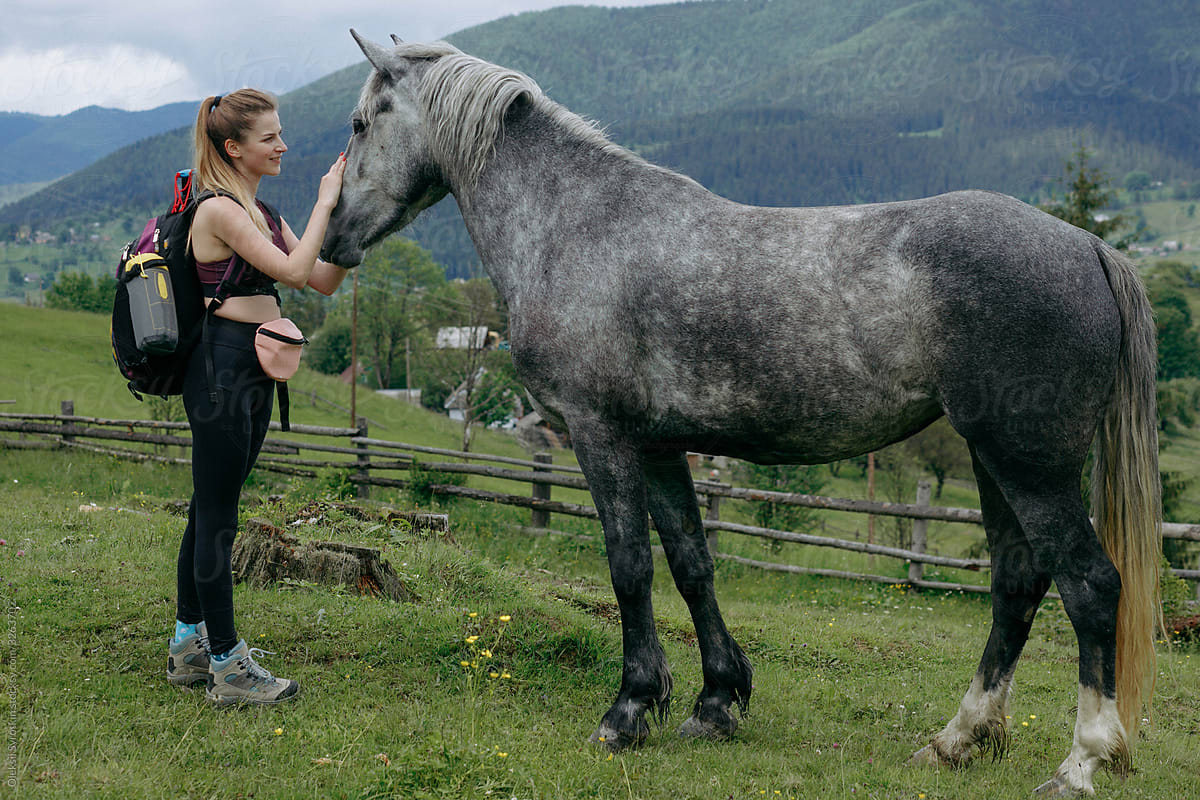 Woman meeting wild horse