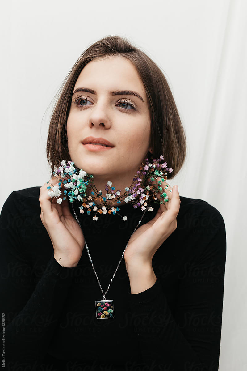 woman wearing floral epoxy necklace