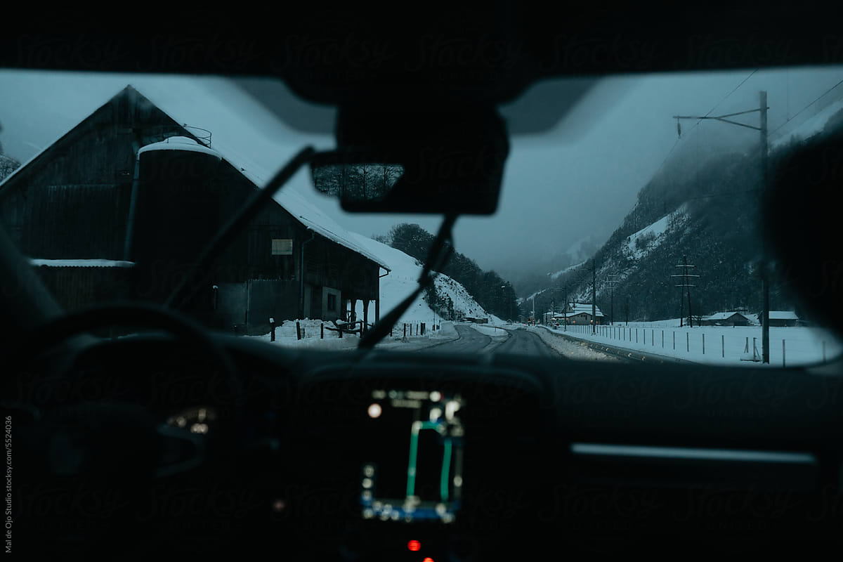 Snowy town from a car