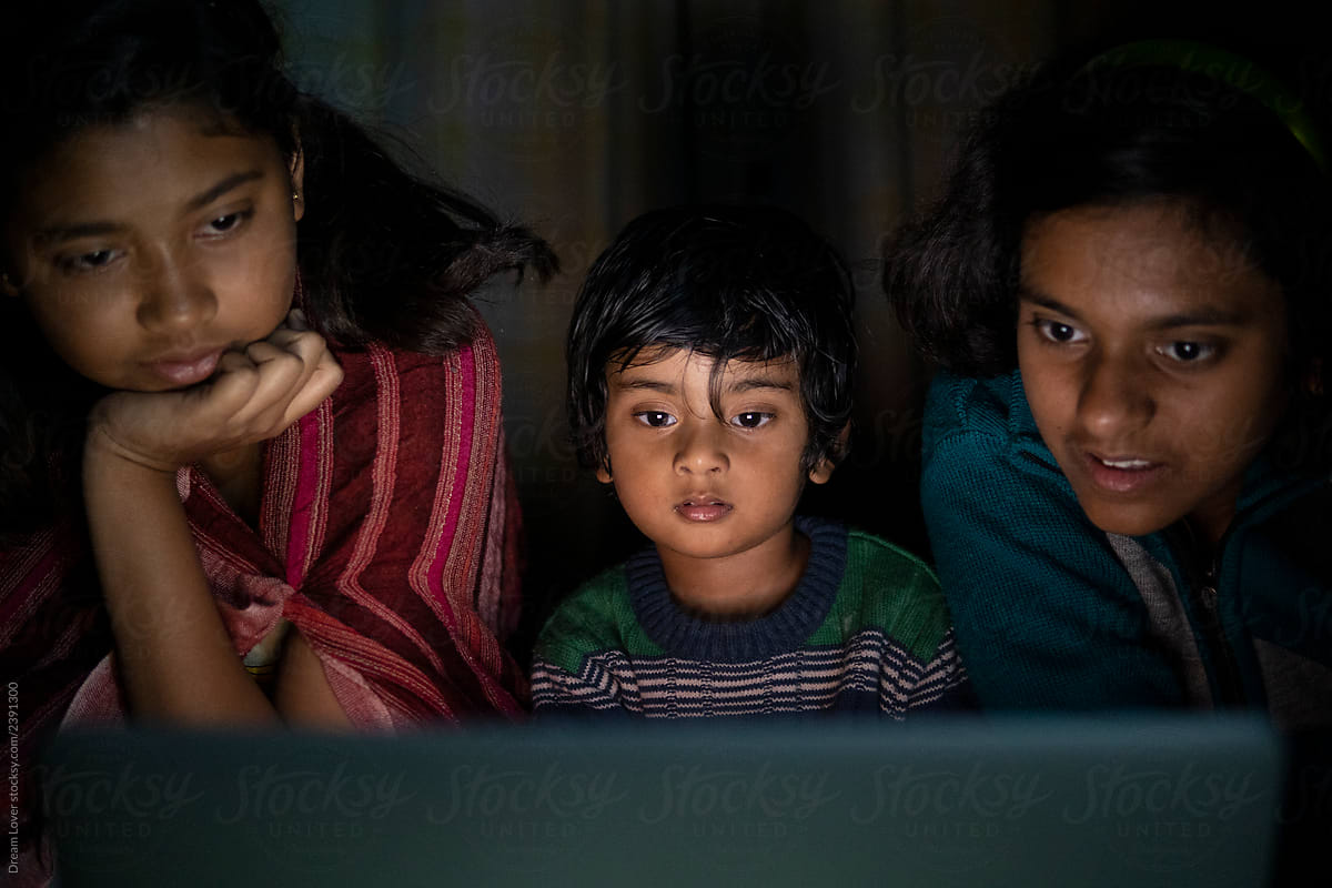Cute Girl Watching Cinema With Elder Sisters In A Laptop