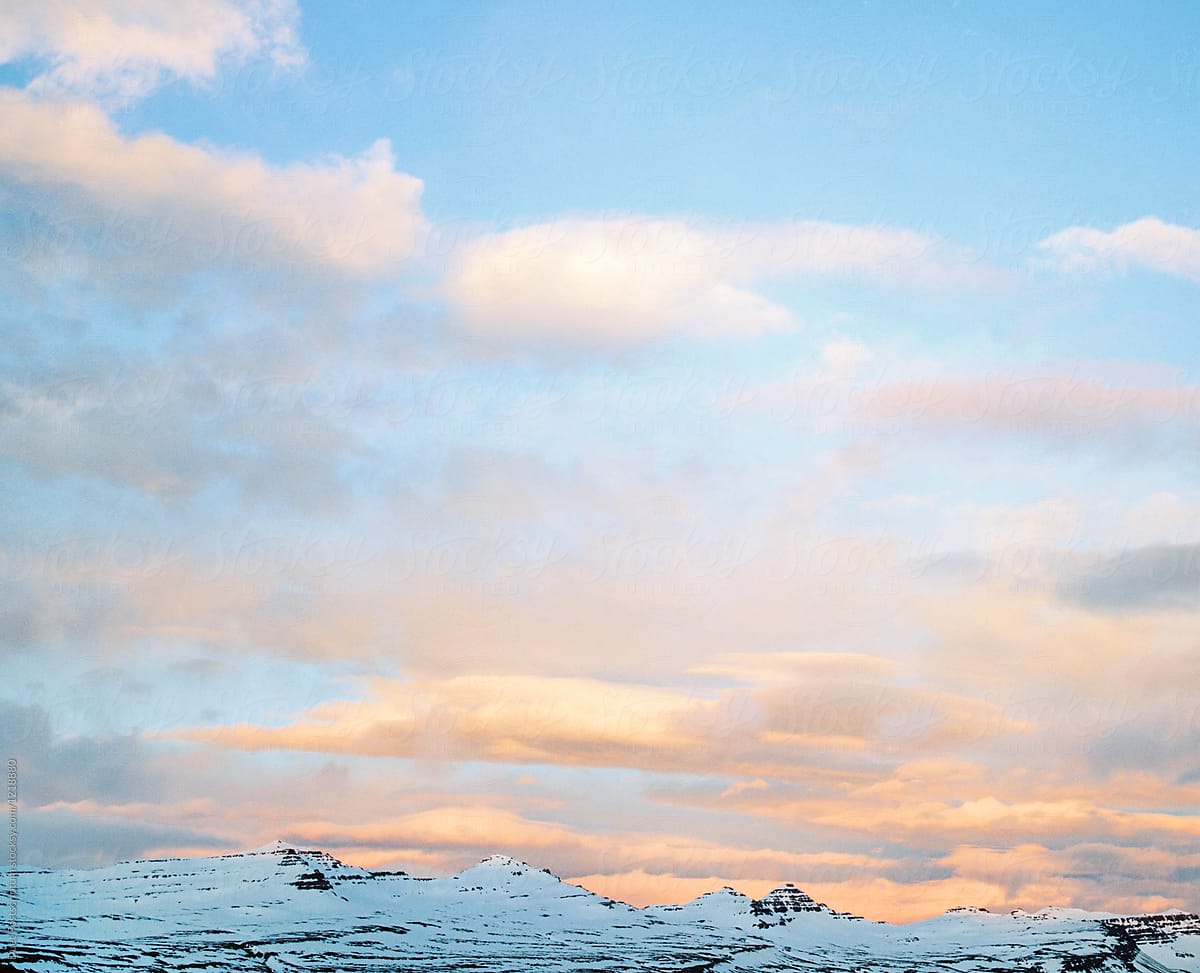 View of mountains' peaks and cloudy sky in Iceland