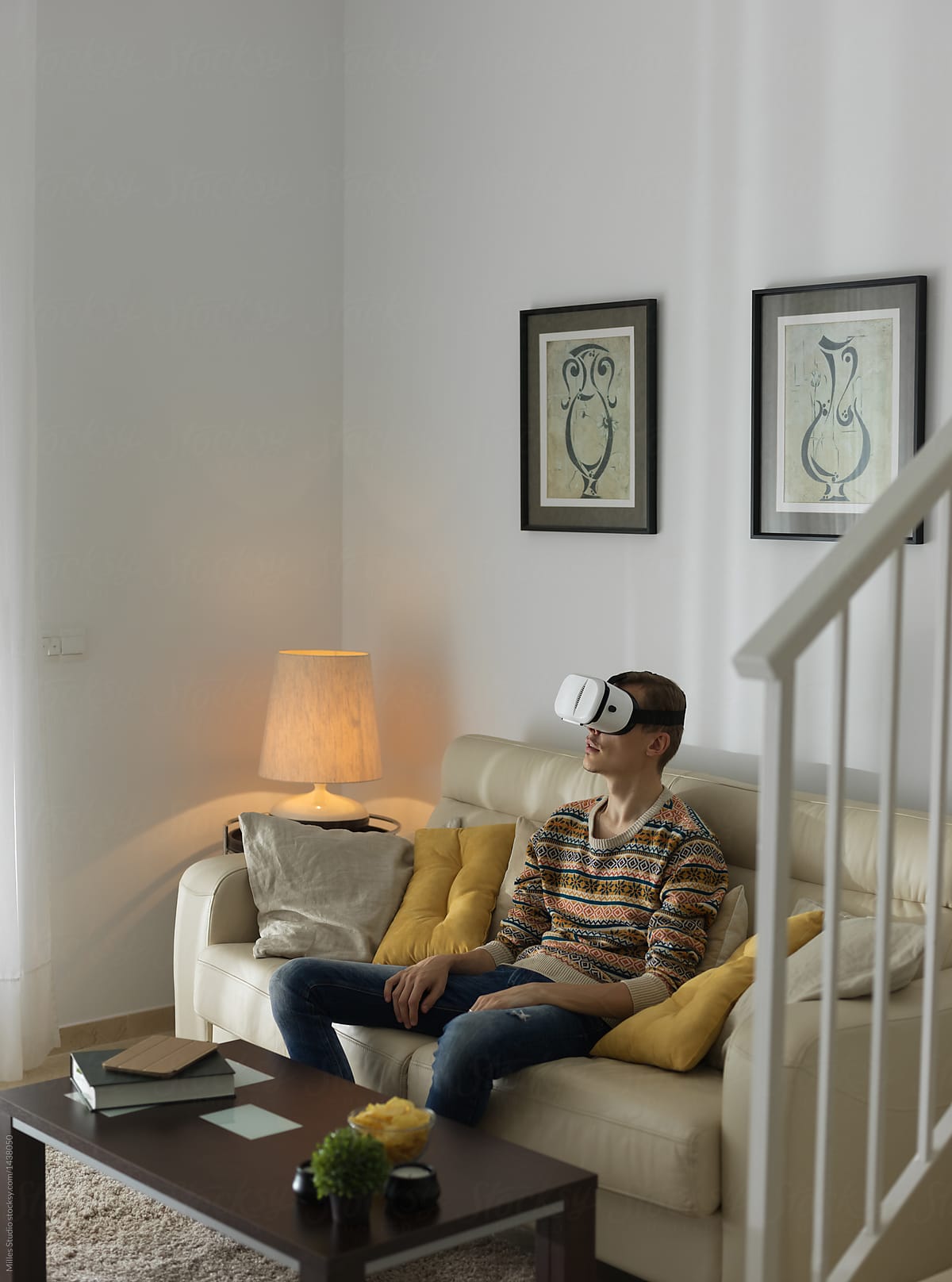 Man watching VR on sofa
