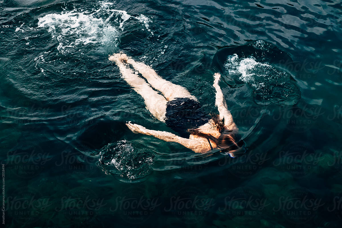 Woman swimming in the ocean