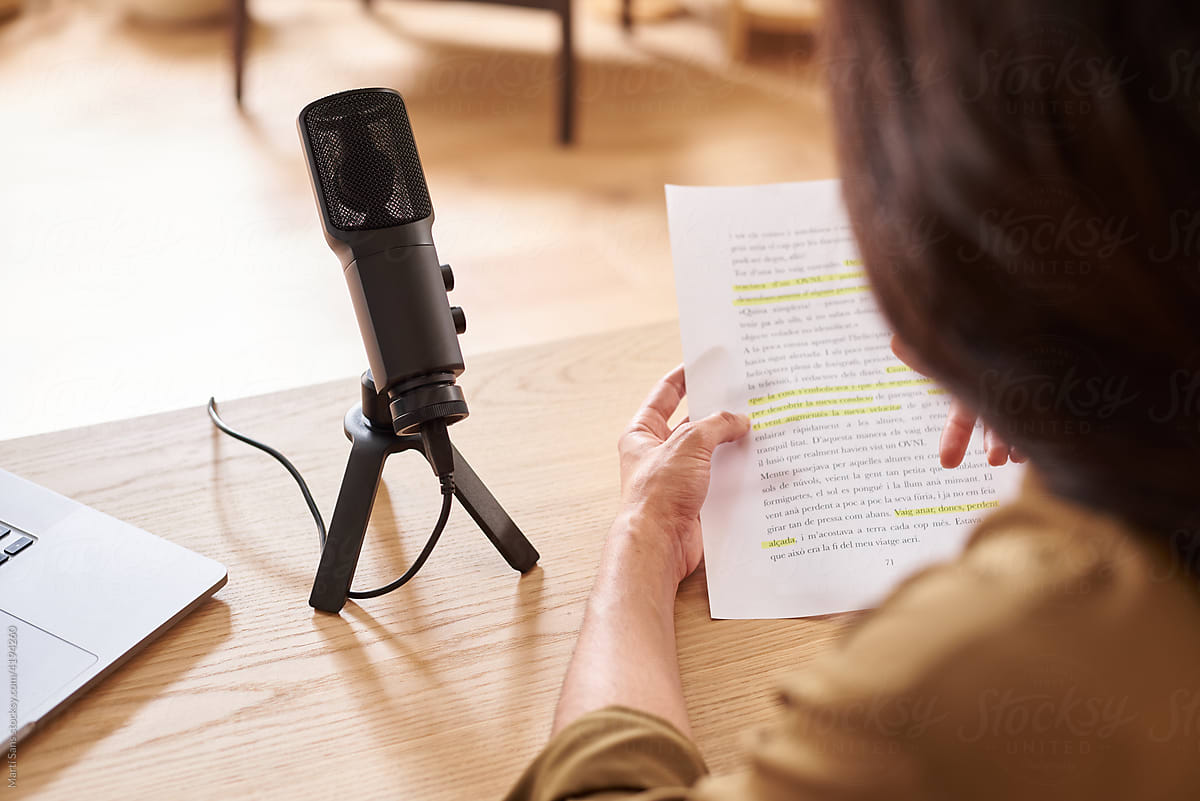 Blogger reading notes during podcast recording