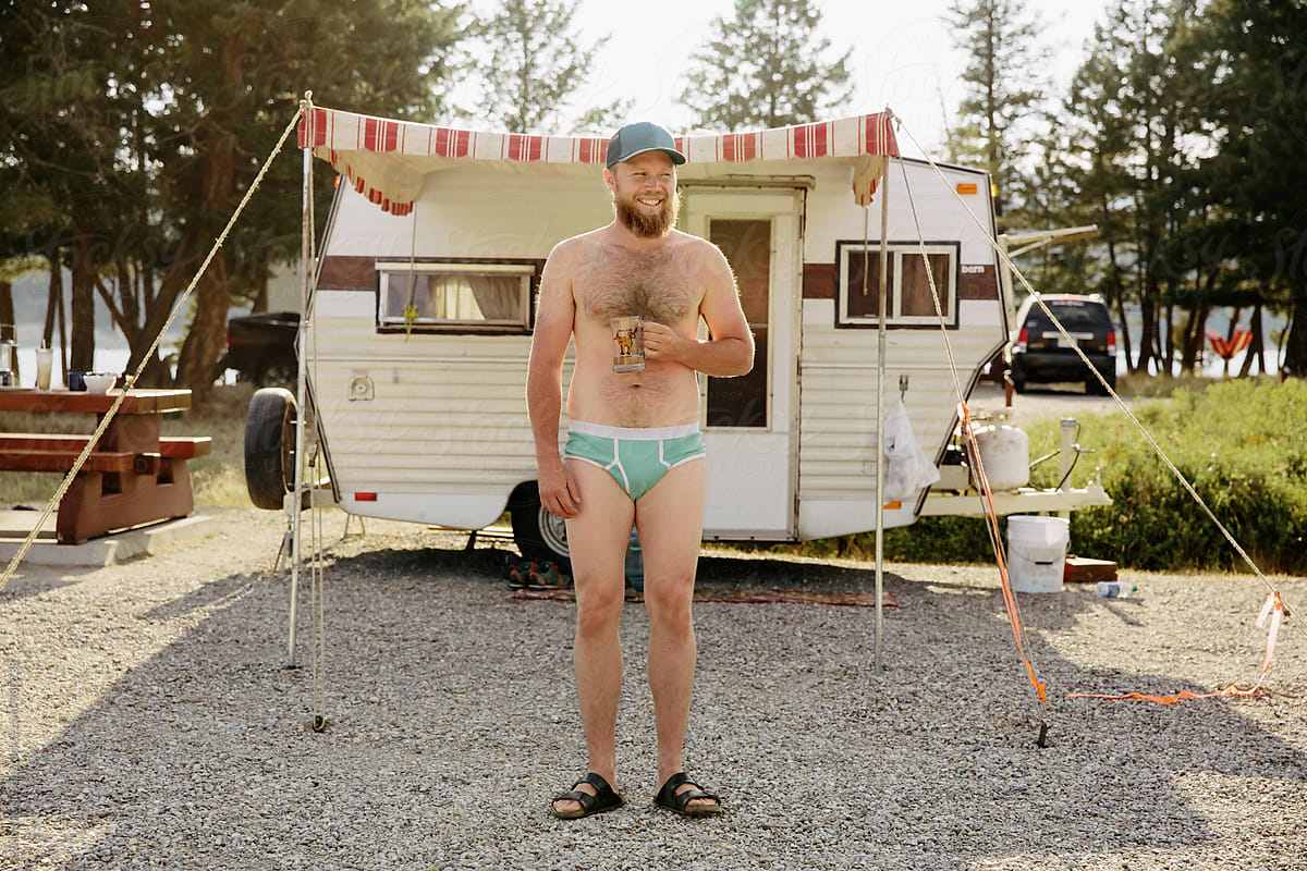 Man Standing In His Underwear by Stocksy Contributor Shaun