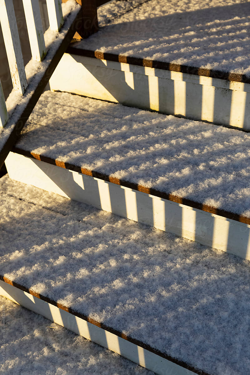 Light Dusting of snow with morning light on stairs