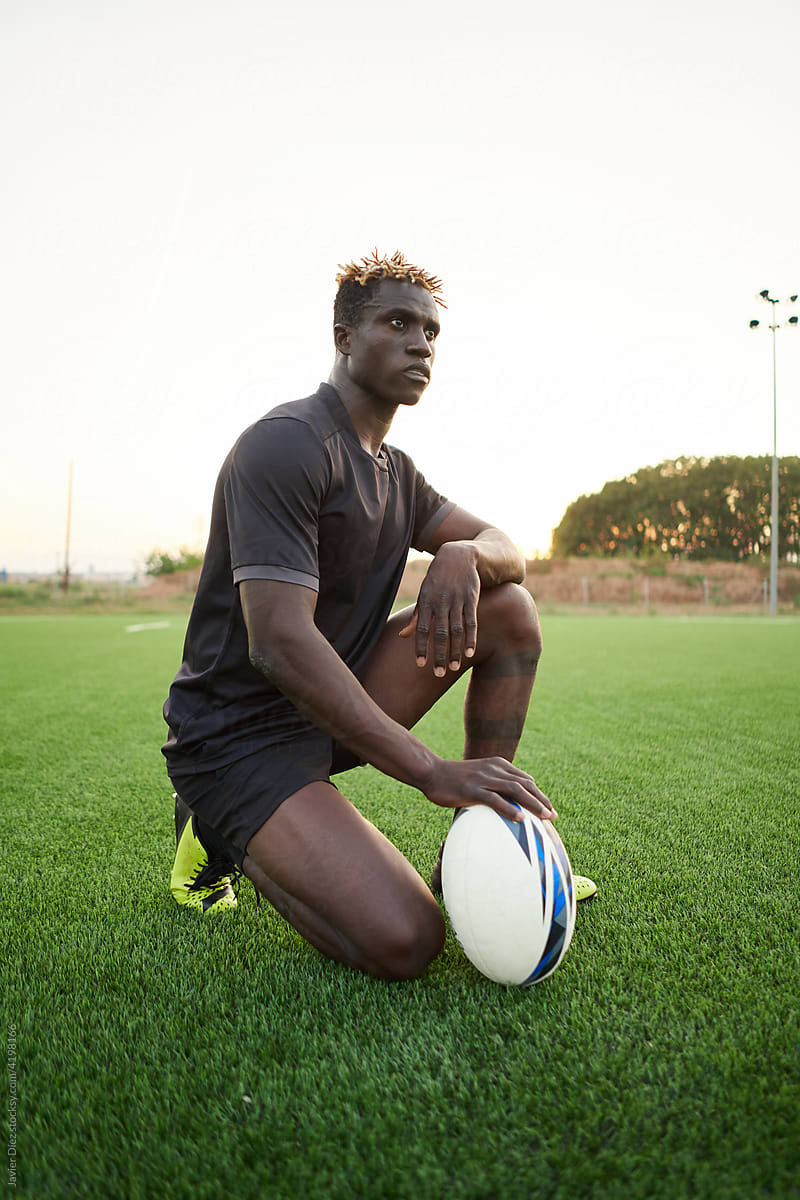 Black man with rugby ball