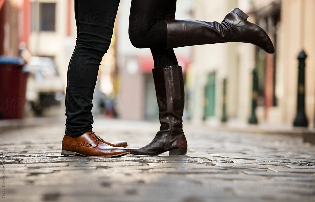 European Romance: Couple Kissing in Cobblestone Alley