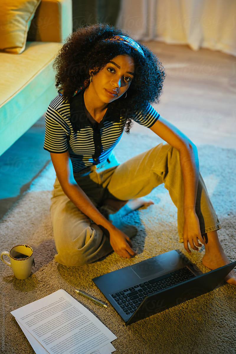Black woman working online at home
