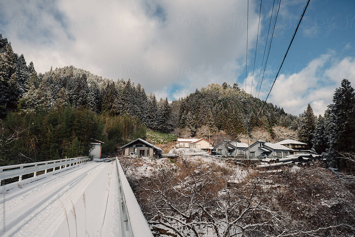 On The Bridge In Japanese Local Village With Snow In Winter Season