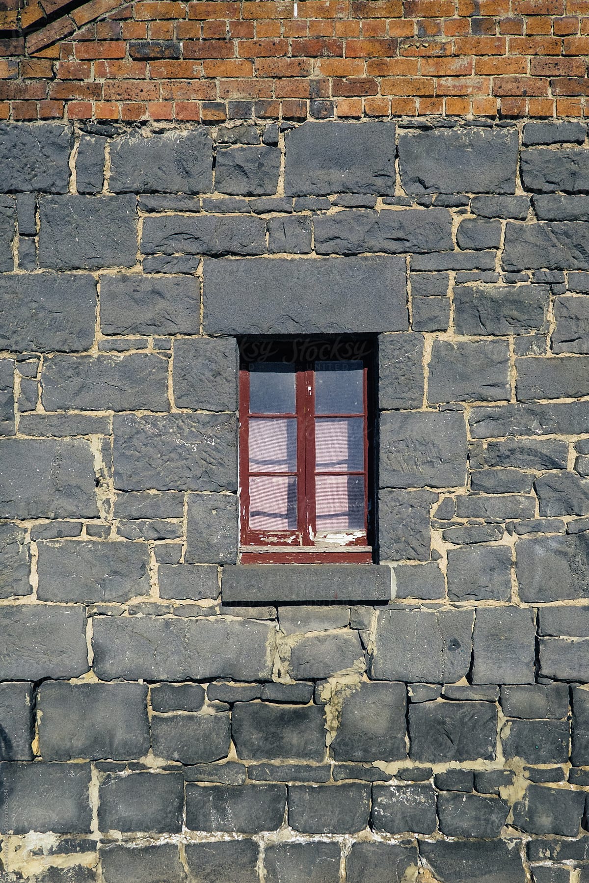 Tiny window in Bluestone building