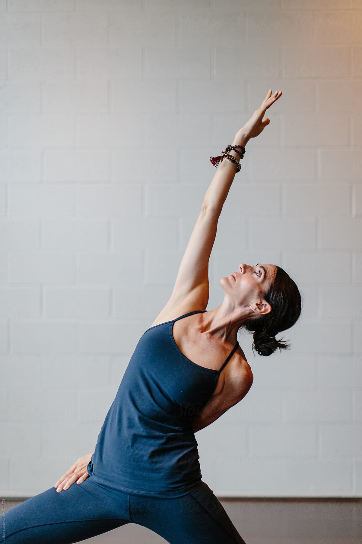 Beautiful Woman Practicing Yoga In A Studio Del Colaborador De Stocksy Jakob Lagerstedt
