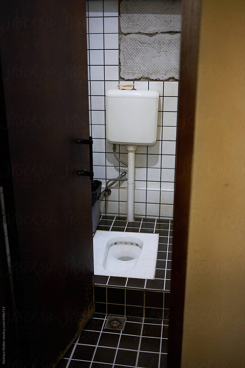 Squatting Toilet At A Public Washroom In Xishuangbanna, Yunnan, China.