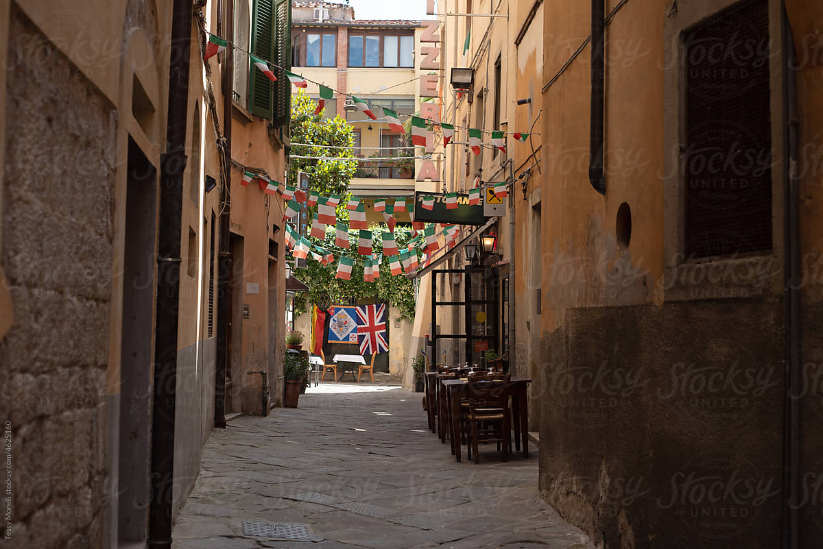 Typical Pisa, Tuscany narrow street with restaurants