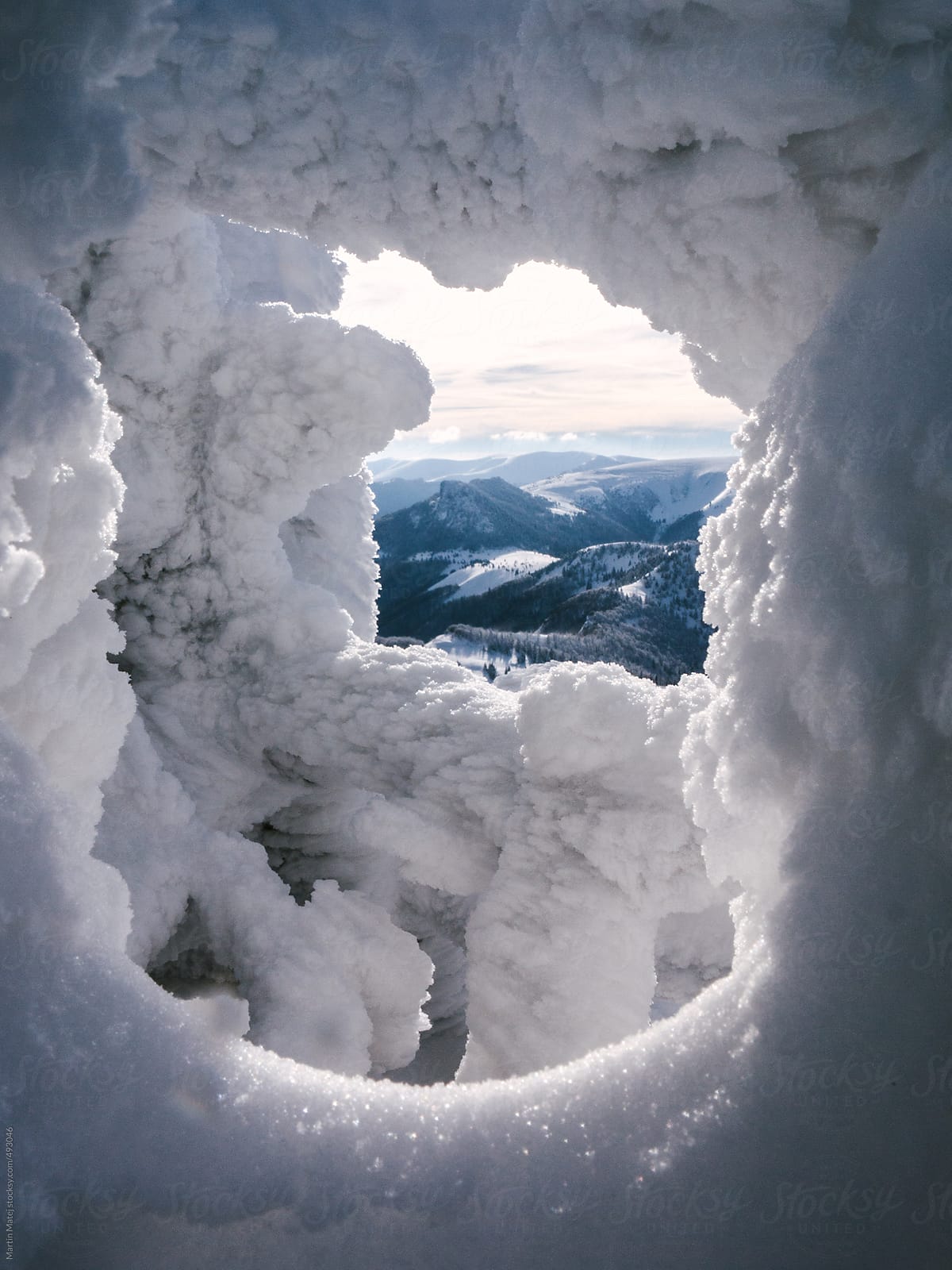 Velka Fatra mountains framed in hole in snow