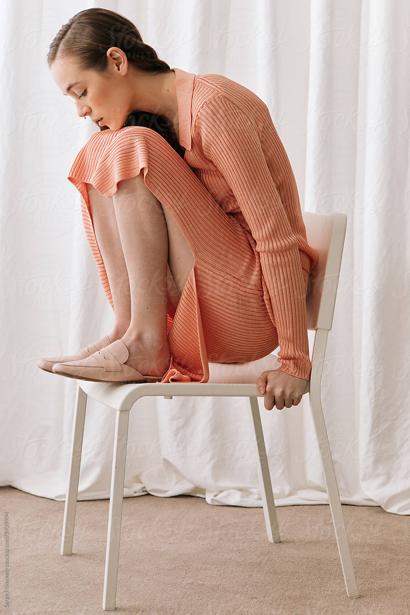 Elegant woman in peach outfit