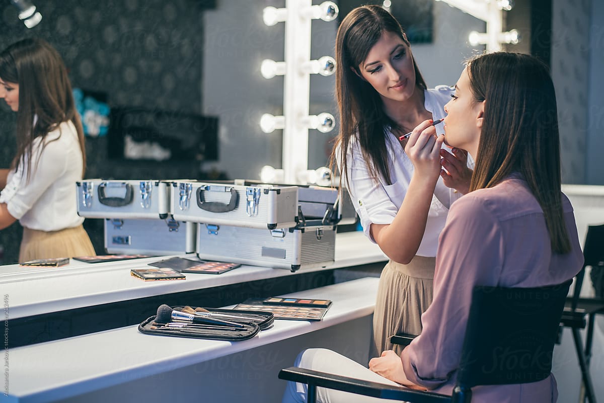Female makeup artist applying makeup on her client