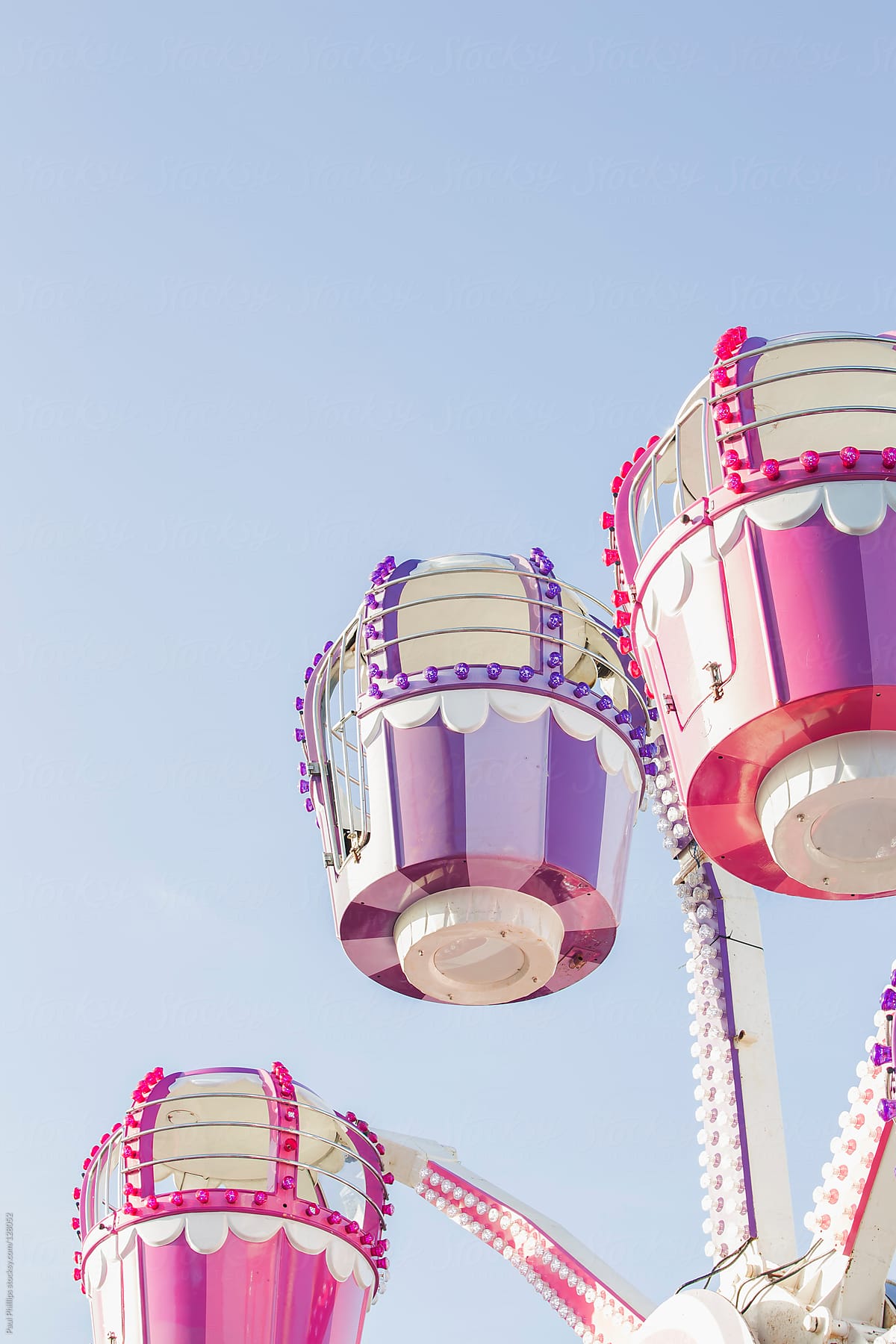 Small pastel children\'s ferris ride at a carnival