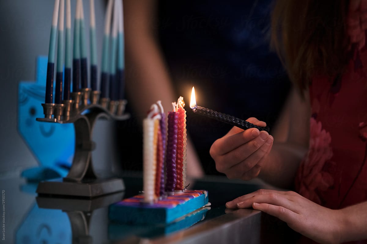 Hanukkah: Anonymous Girl Lighting Candles With Shamash